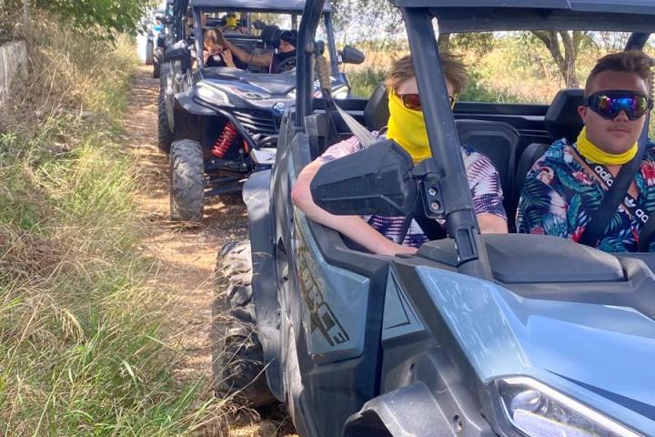 a car parked on a dirt road