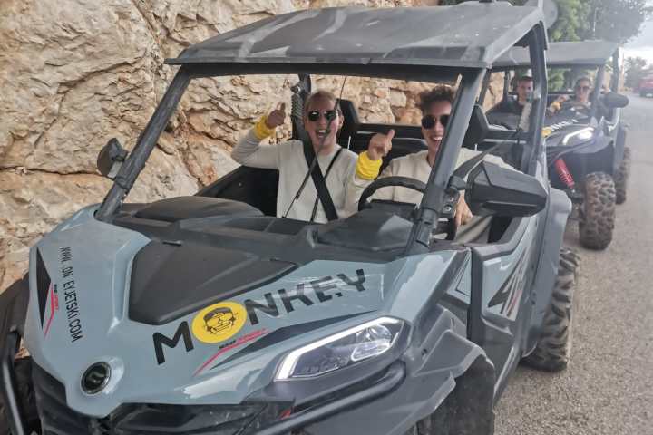 a motorcycle is parked on the side of a mountain