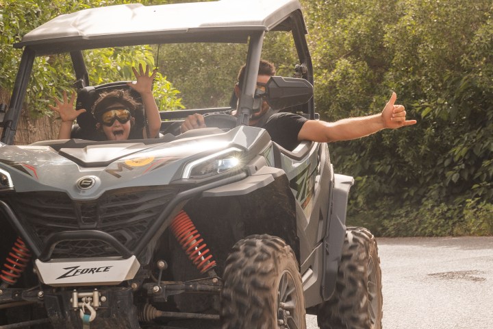 a man riding on the back of a truck