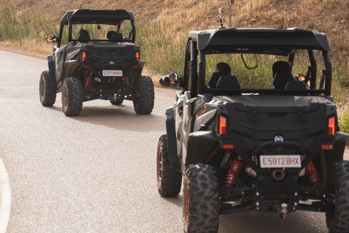 a truck driving down a dirt road