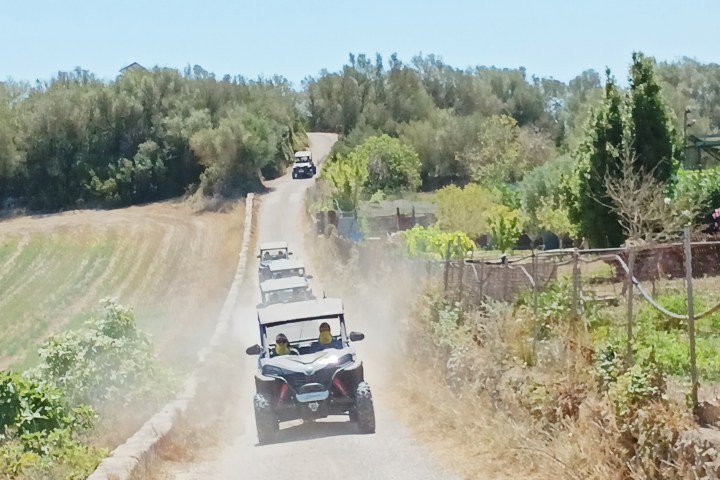 a truck traveling down a dirt road