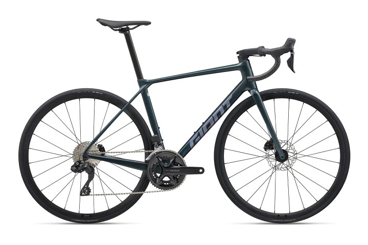 Sleek, dark blue road bike with drop handlebars and disc brakes, viewed from the side.